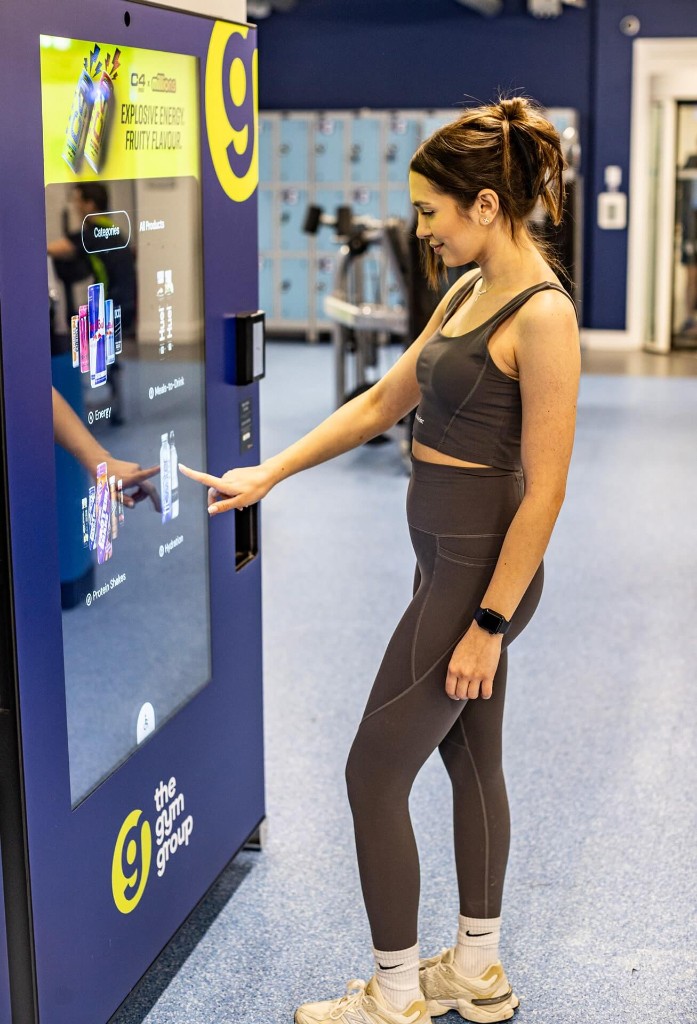 Someone using a connected vending machine